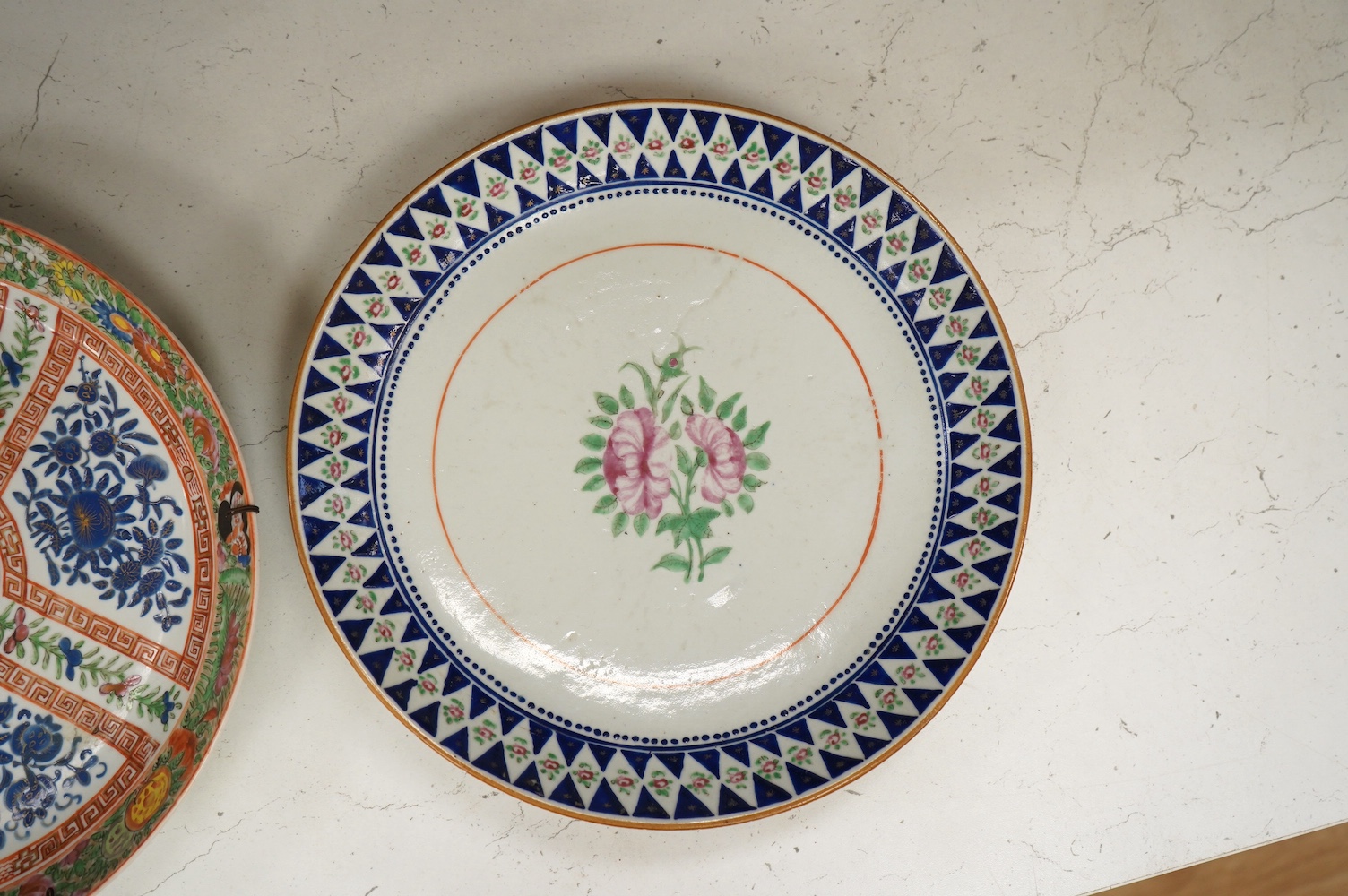 A Chinese enamelled floral porcelain dish made for the Persian market, c.1905 and two other Chinese plates, 28cm diameter. Condition - good, one dish sounds dull